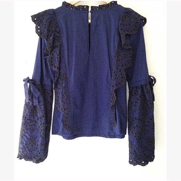 Amaryllis. Eyelet bell sleeve blouse with bows . - Picture 2 of 3